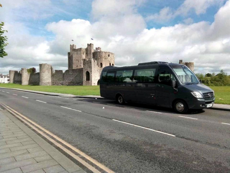 Curran Coaches minibus at Trim Castle - Donegal Coach Hire, Ireland
